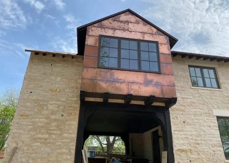 Copper metal panel facade on a stone building for Metal Roof Coating in Beverly Hills
